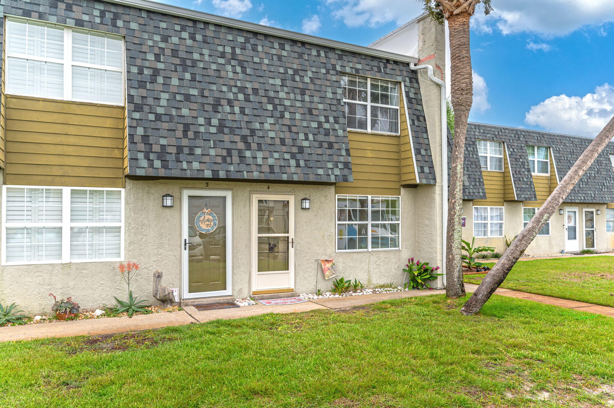 a front view of a house with a yard