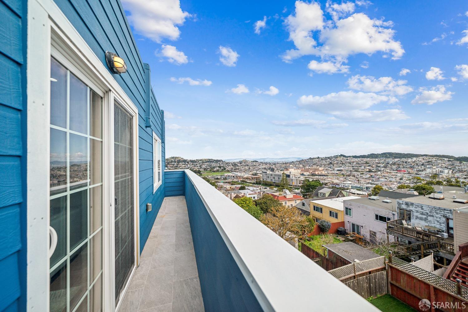 a view of a balcony with city view