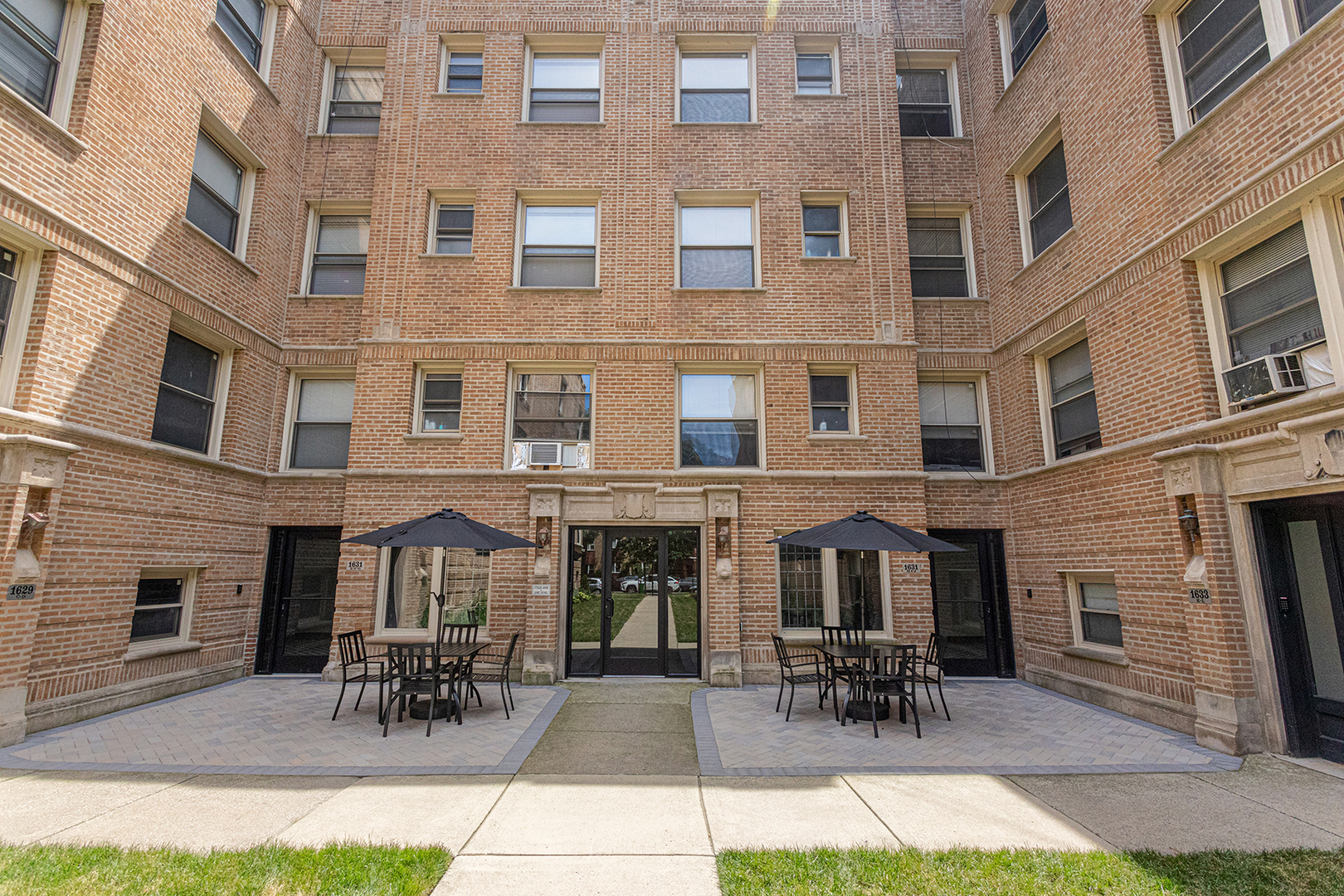 a view of building with with outdoor seating space