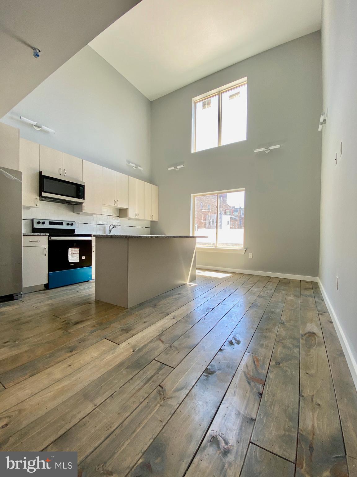 a view of kitchen and wooden floor