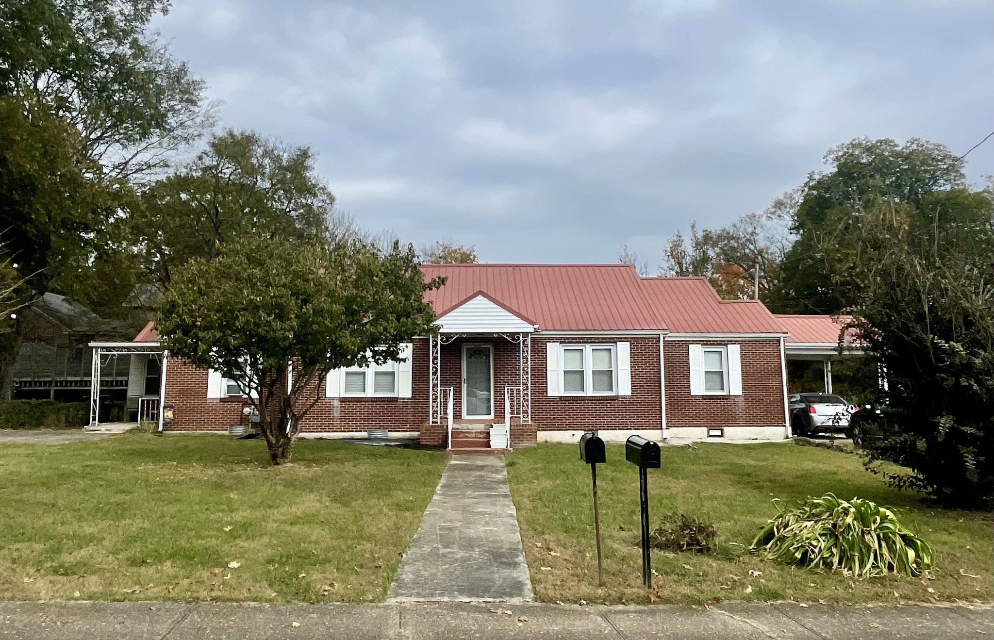 a front view of a house with a yard