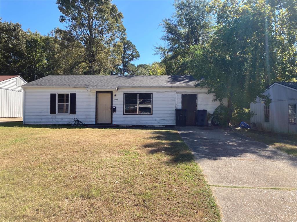 a front view of a house with yard