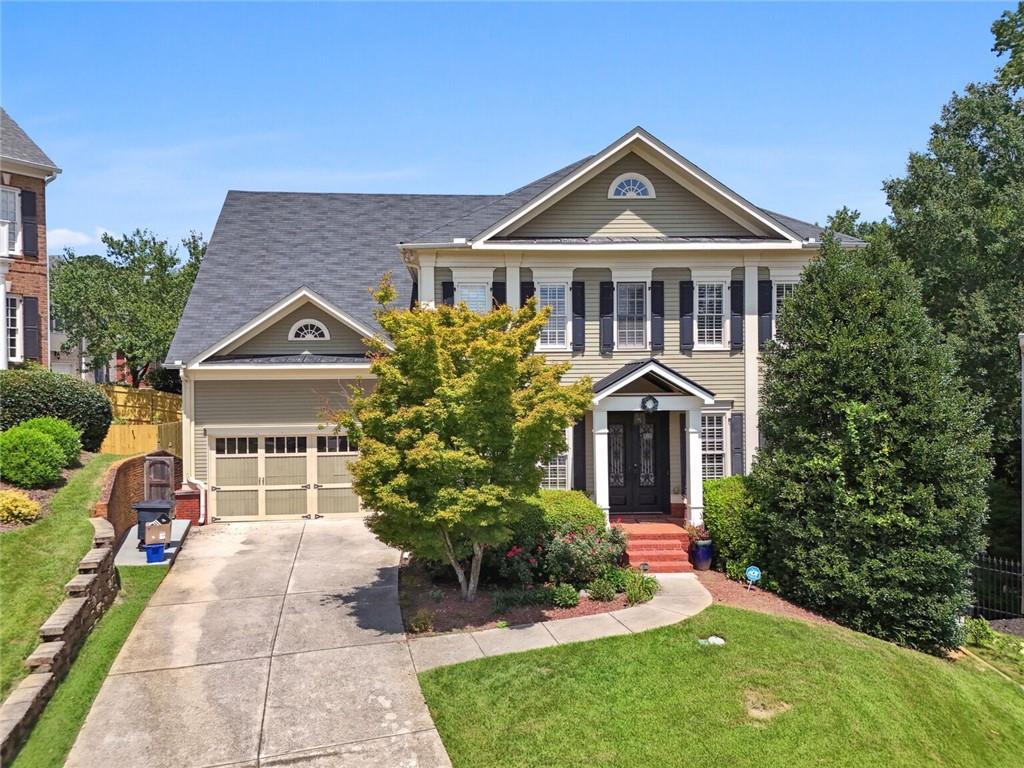 a front view of a house with a yard