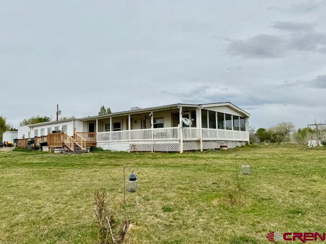 a view of a house with a big yard