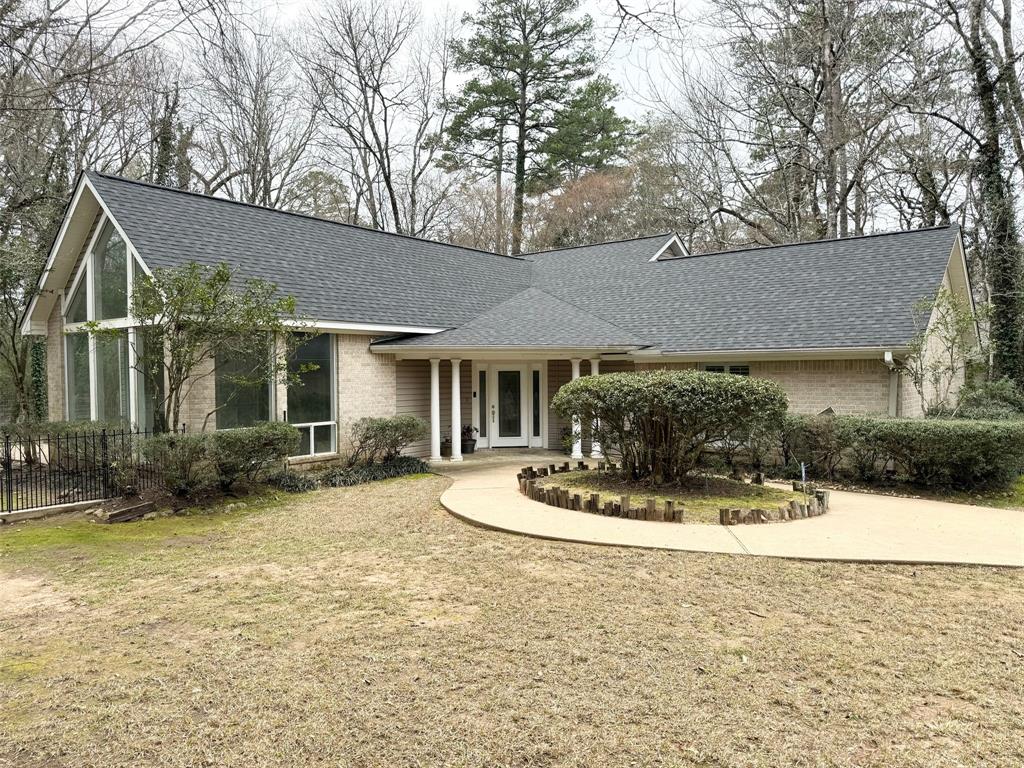 a view of house with outdoor space and sitting space