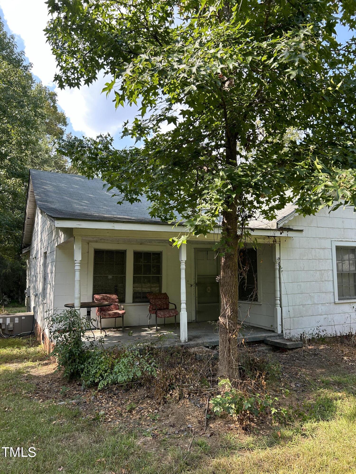 a front view of house with yard and seating area