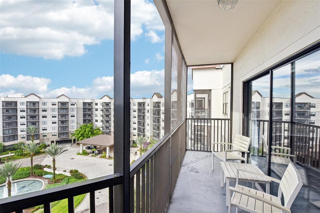 a view of a balcony with chairs