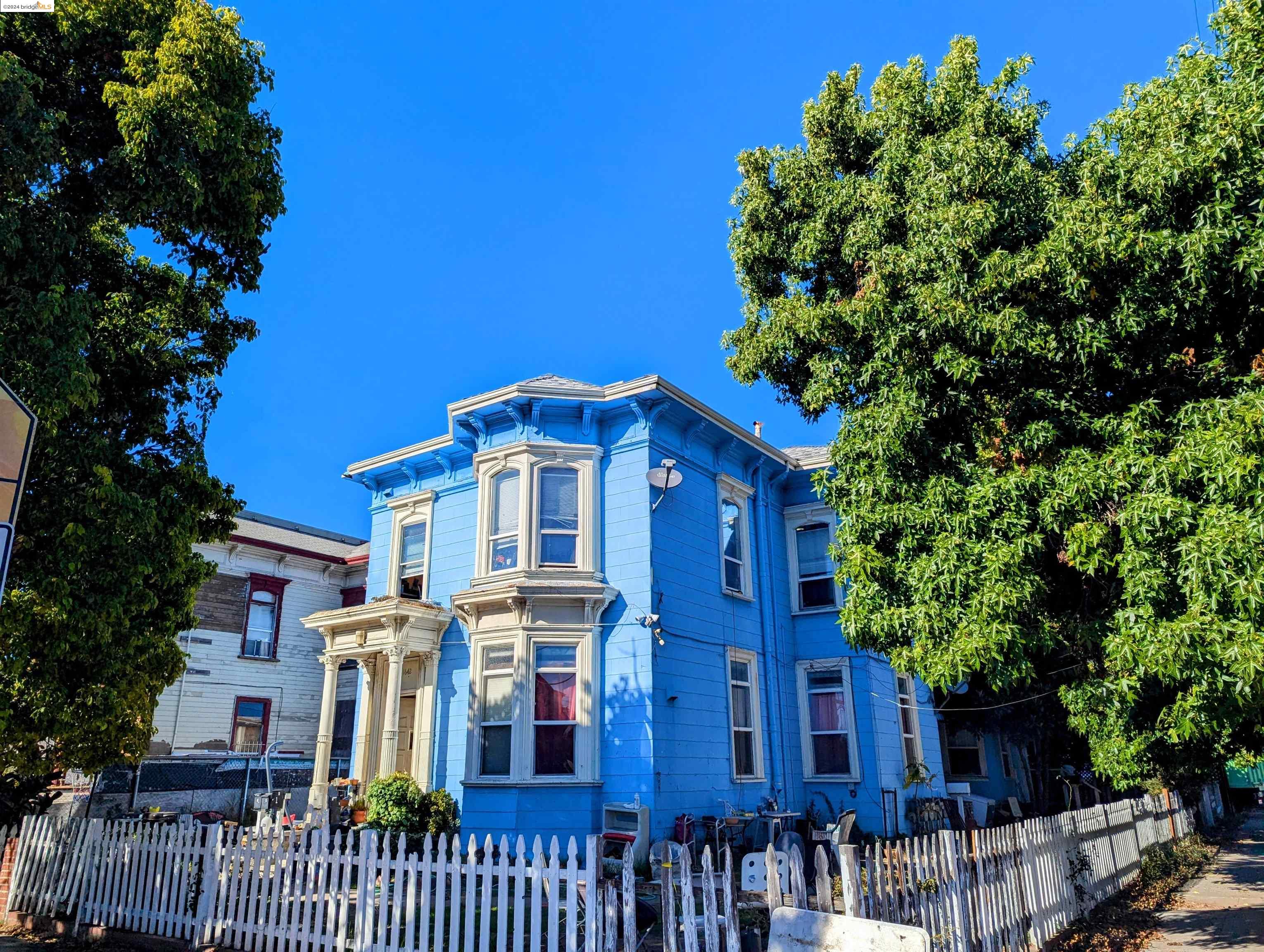 a view of a house with a tree