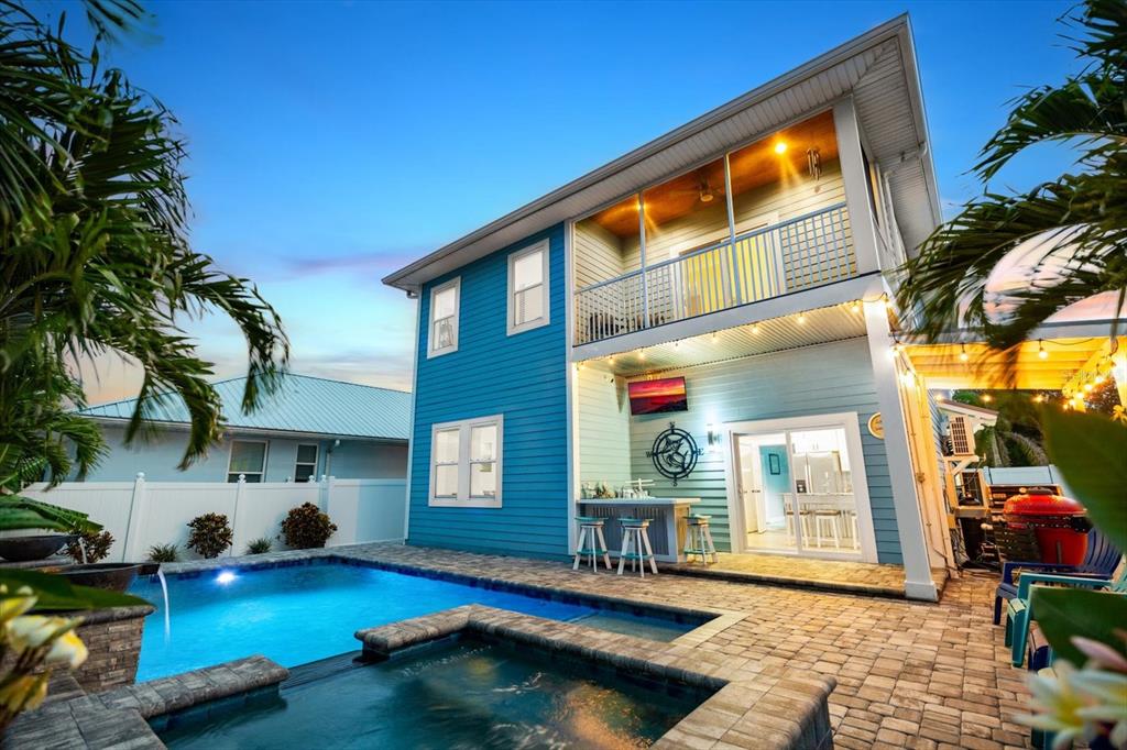 a view of swimming pool with outdoor seating