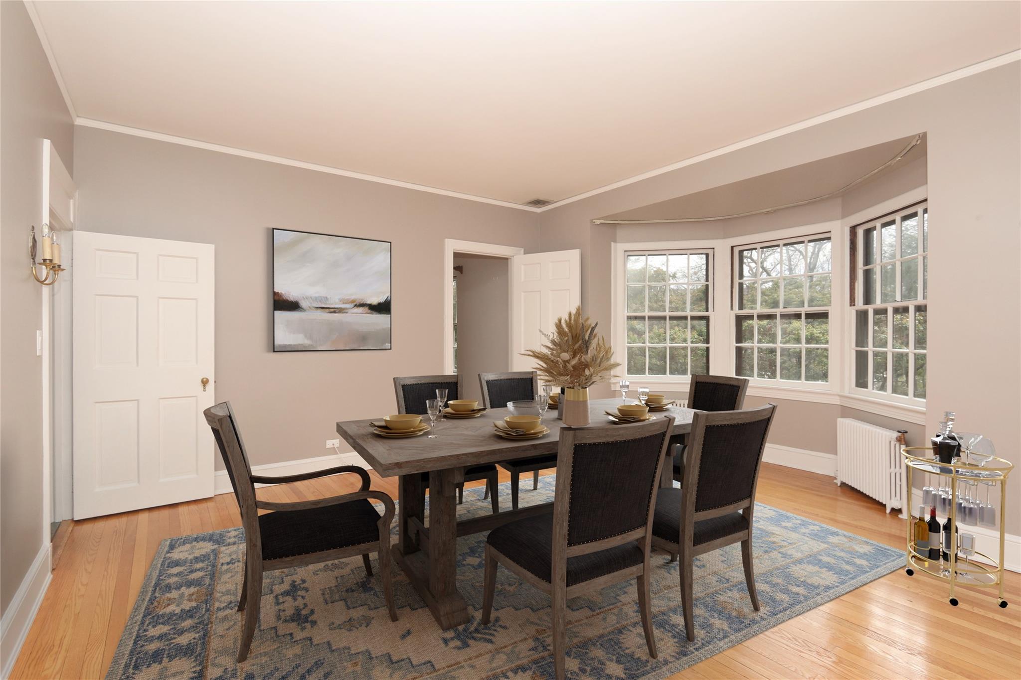 a view of a dining room with furniture window and wooden floor