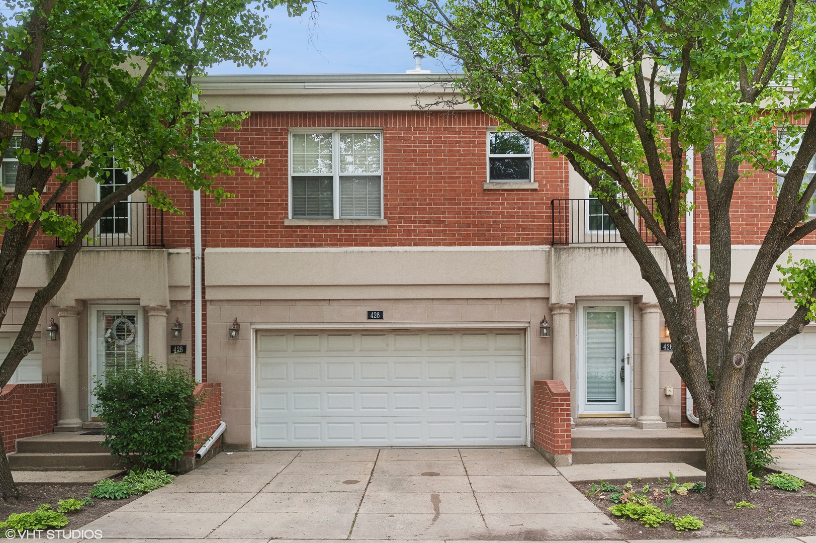 a front view of a house with a garage