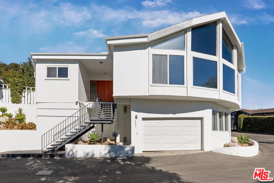 a front view of a house with a garage