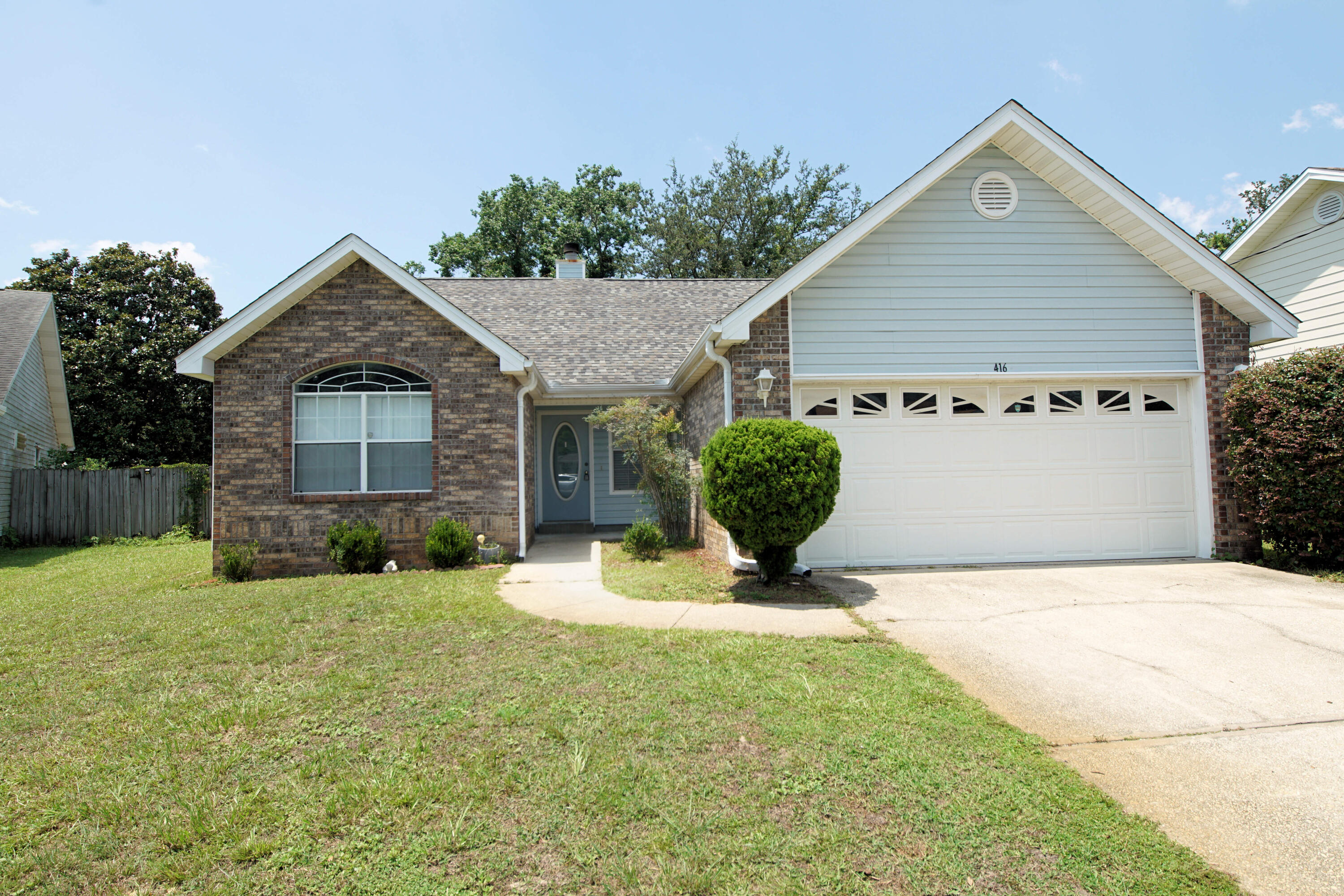 a front view of a house with yard