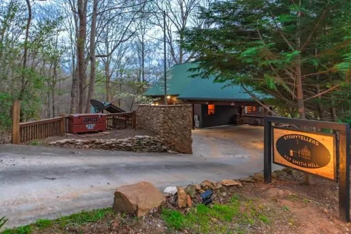 a backyard of a house with barbeque oven and trees