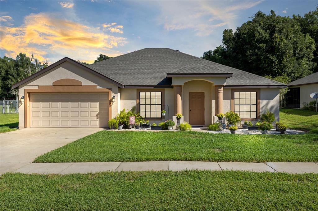 a front view of a house with a yard