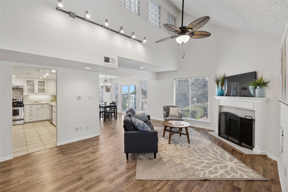 a living room with furniture and a fireplace