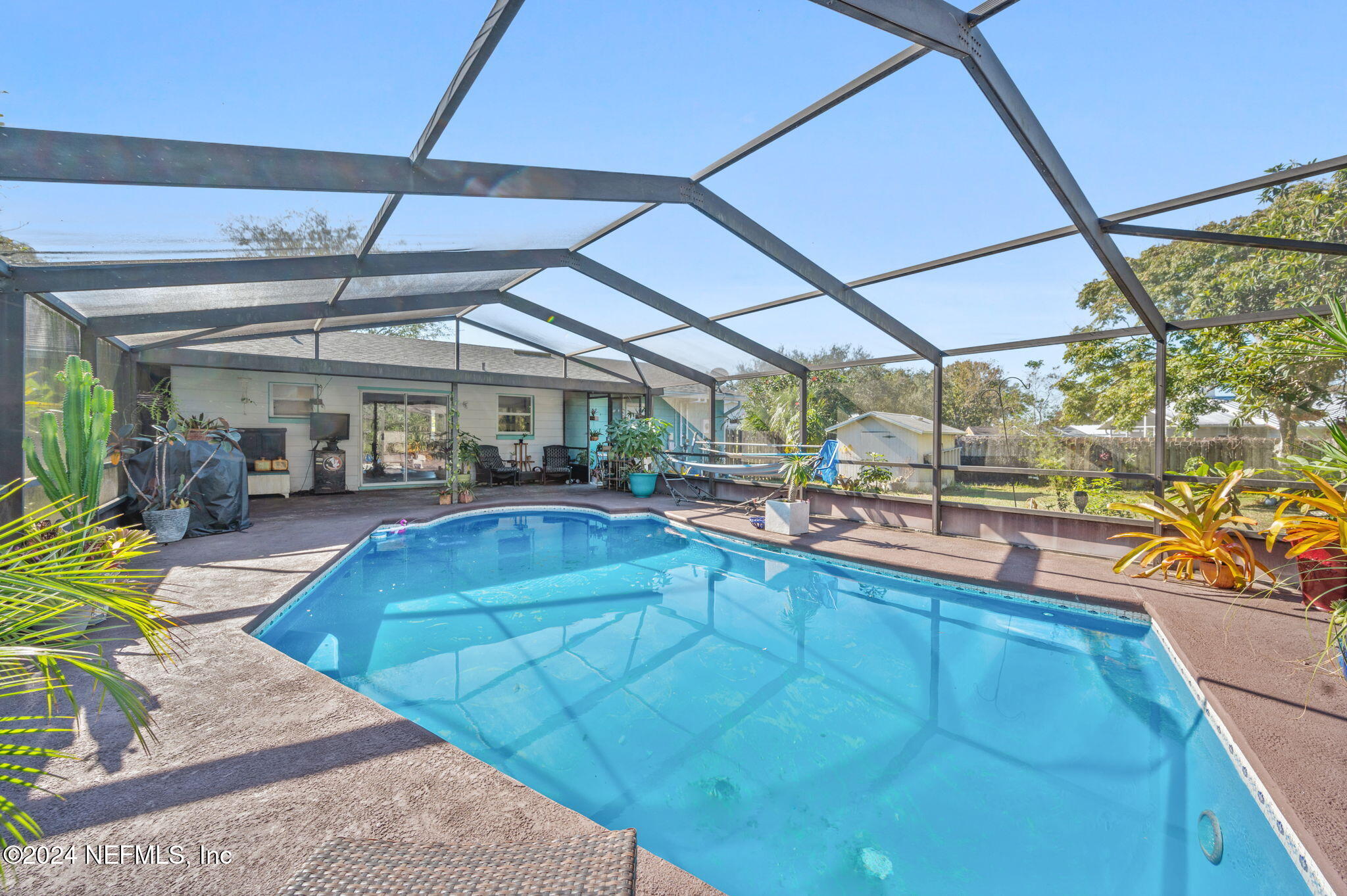 a view of a swimming pool with a patio