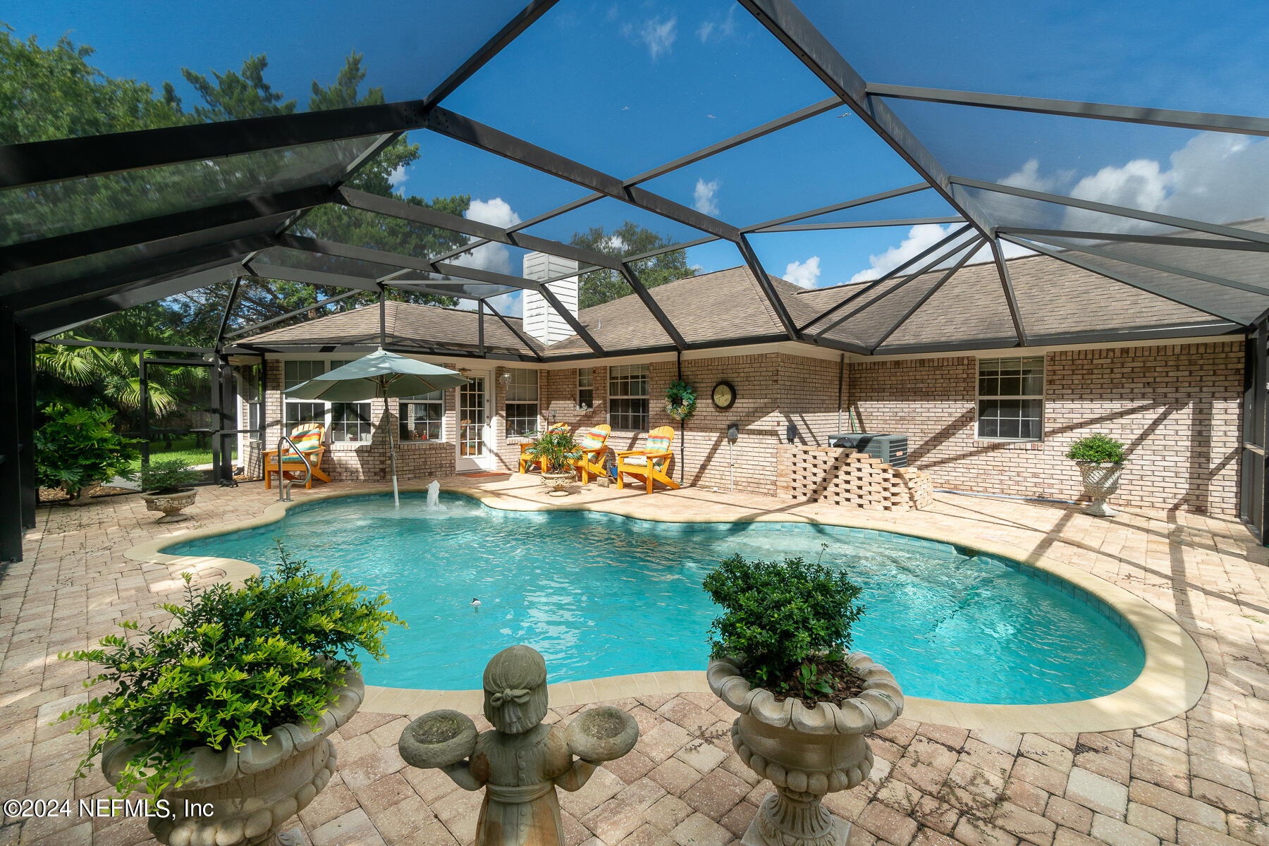 a view of a swimming pool with a patio