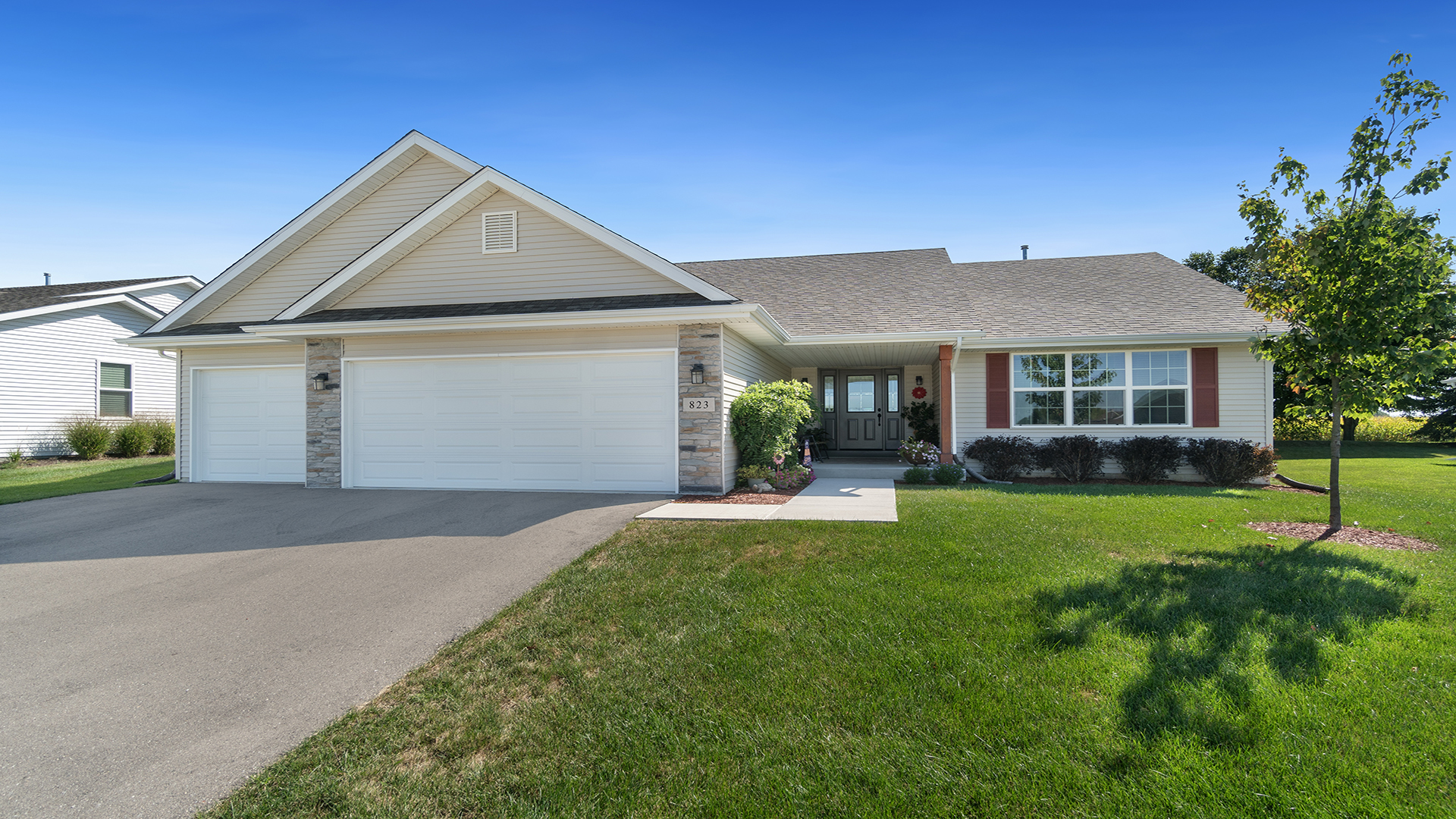 a front view of a house with a yard