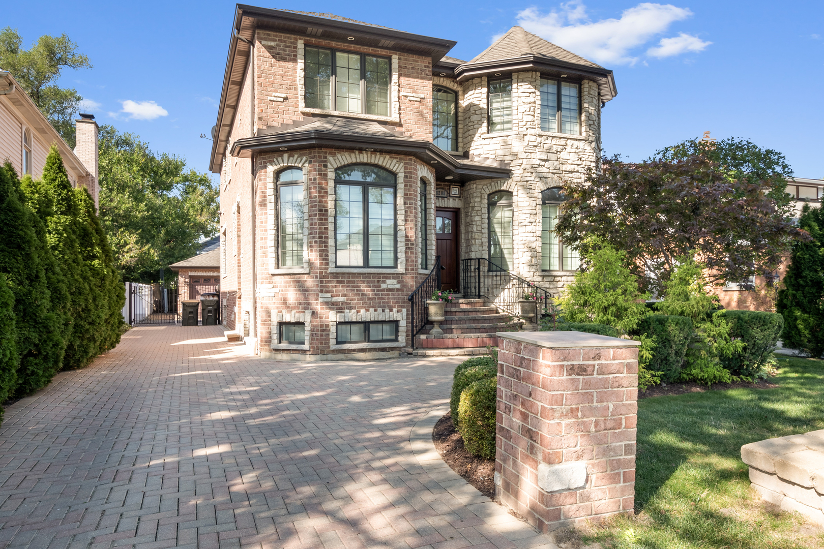 a front view of a house with a garden