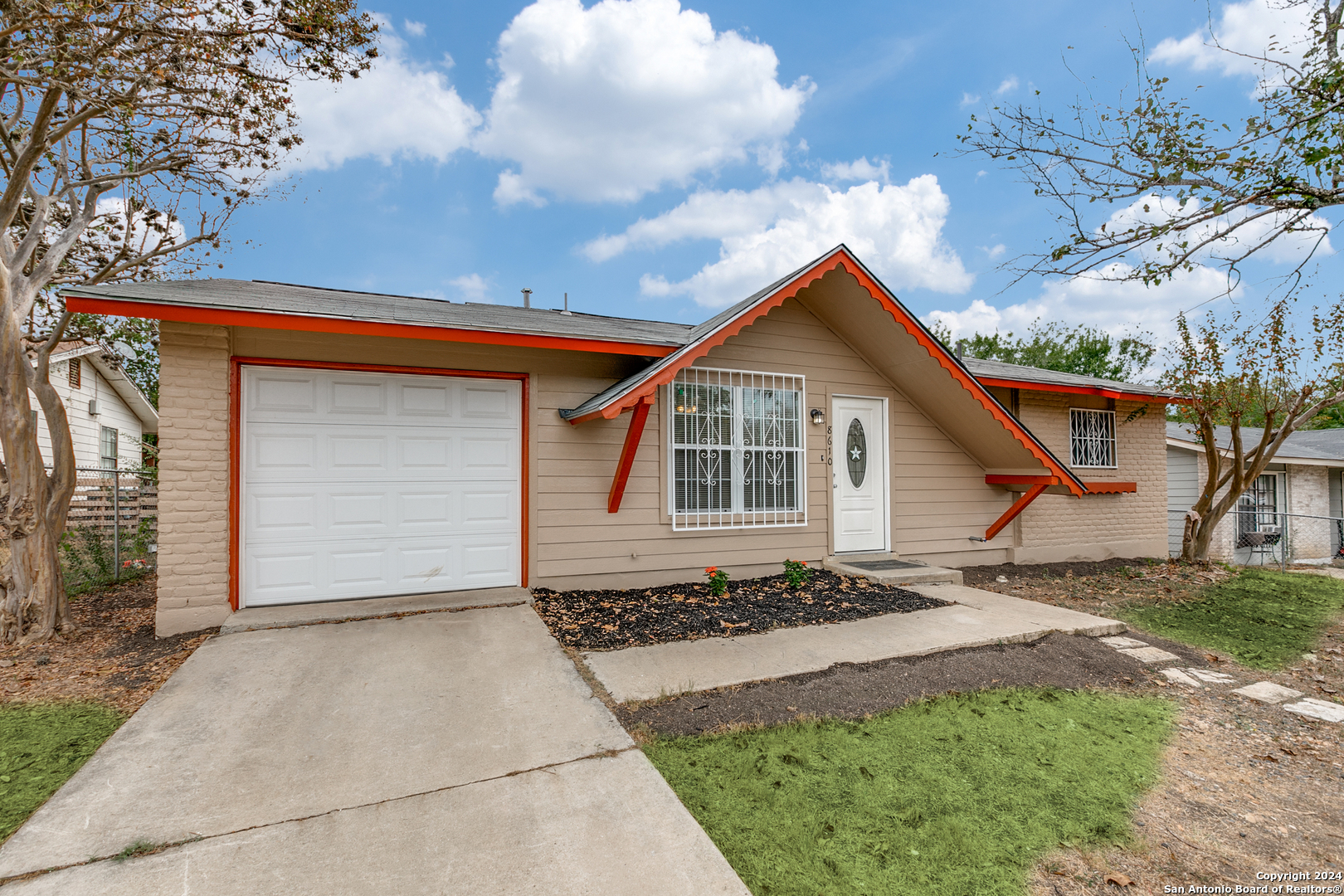 a front view of house with garage