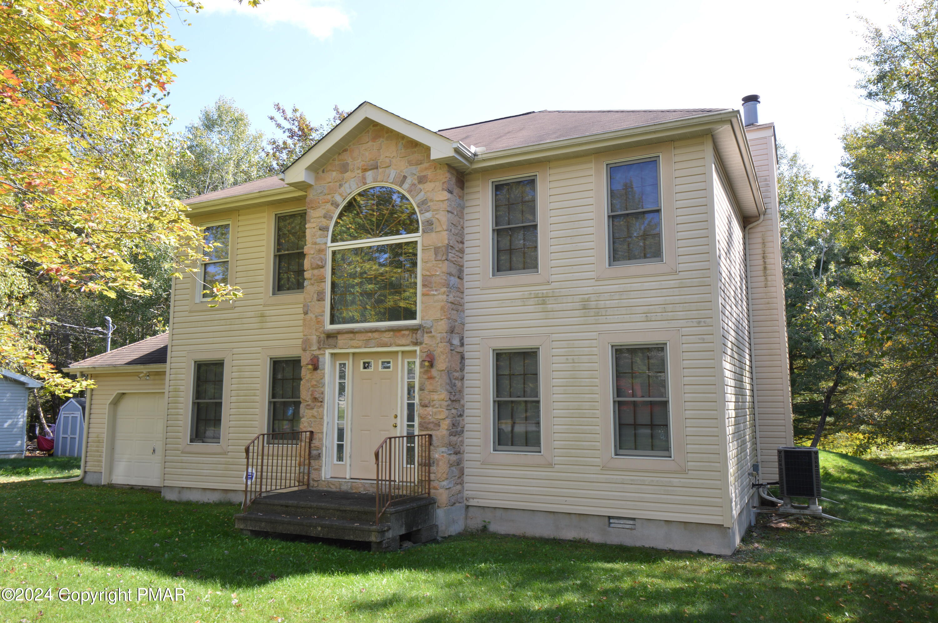 a front view of a house with a yard