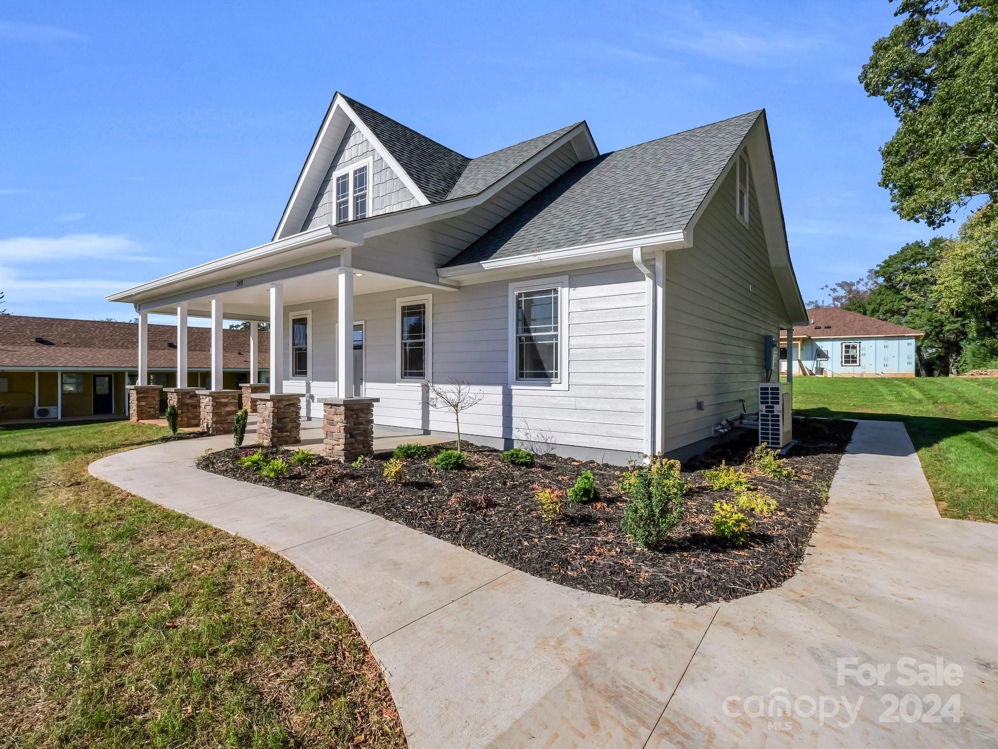 a front view of a house with garden