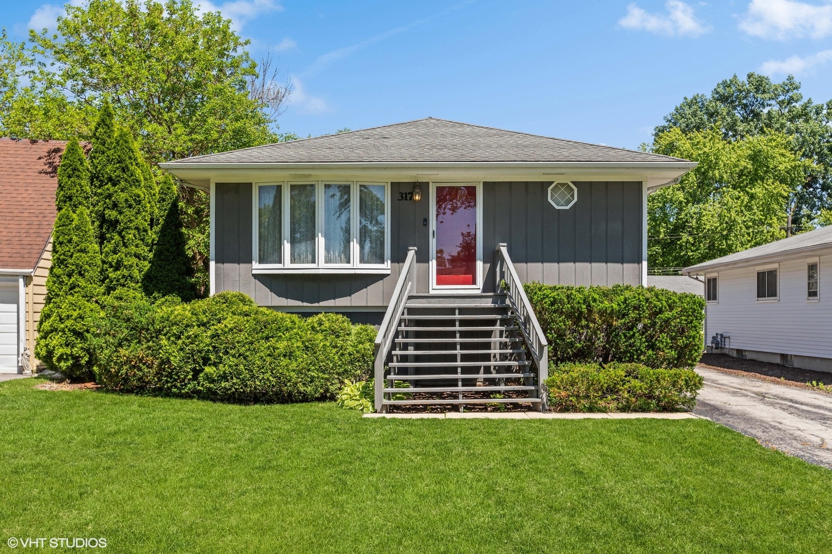 a front view of a house with a yard