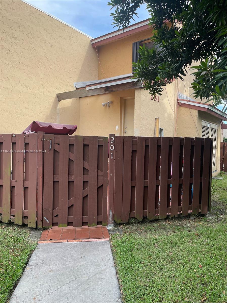 a view of a backyard of the house