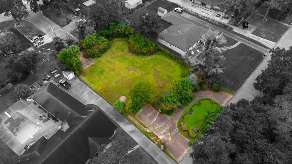 an aerial view of a residential houses with outdoor space