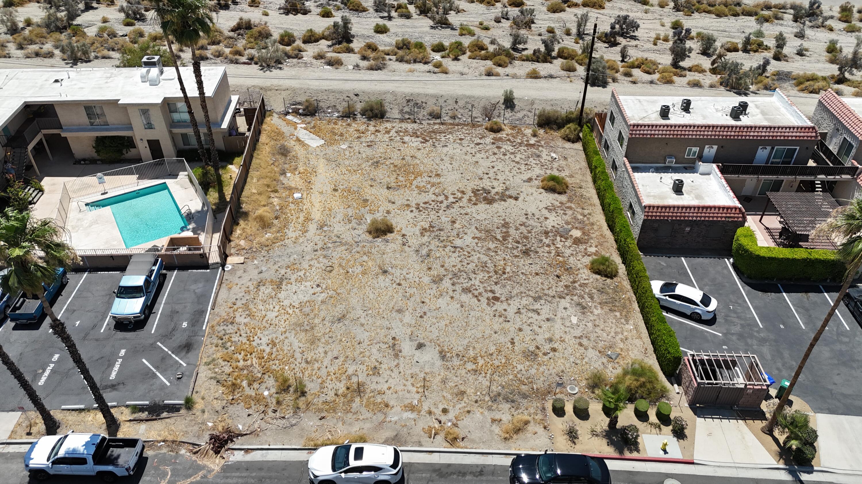 an aerial view of houses with outdoor space