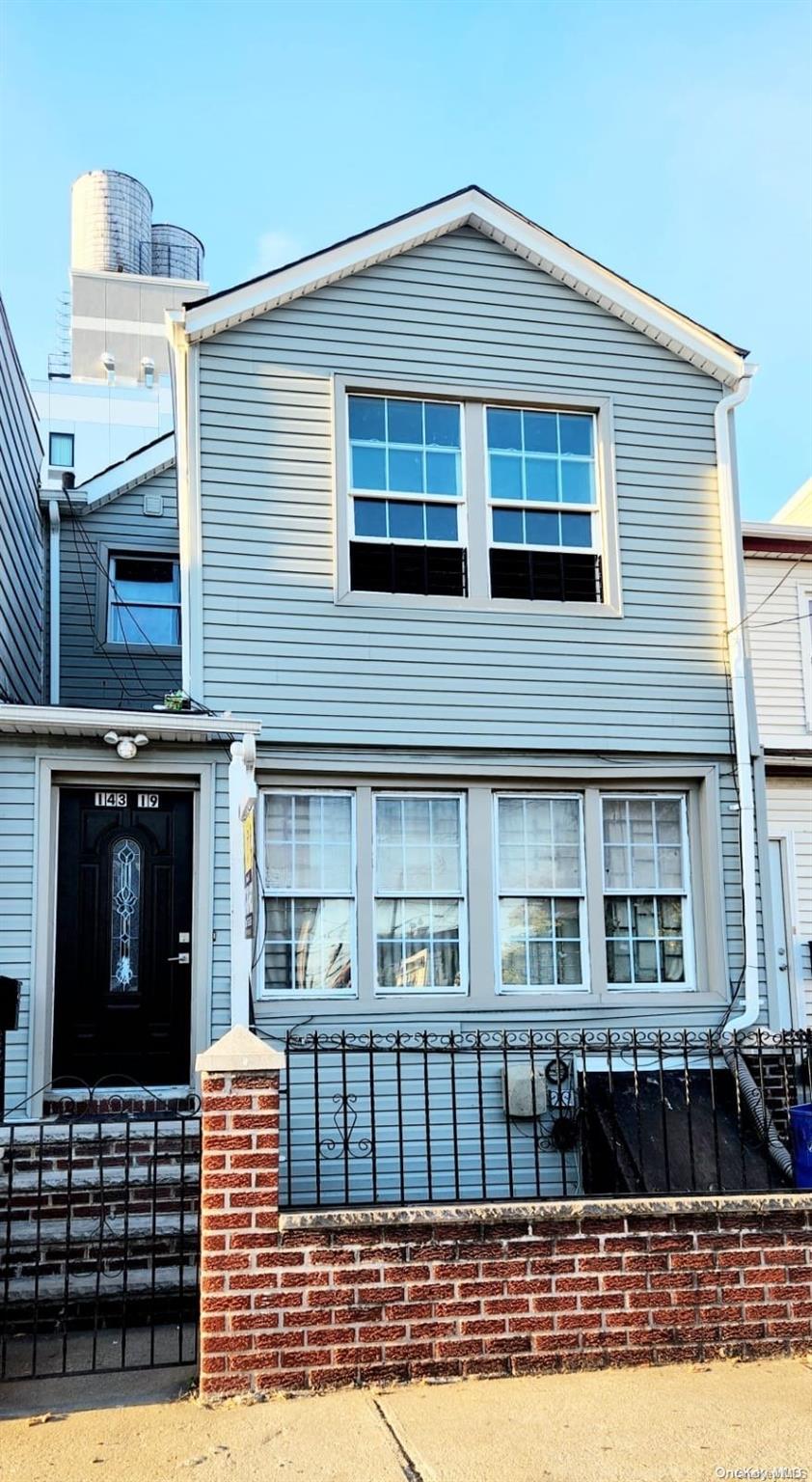 a front view of a house with a balcony