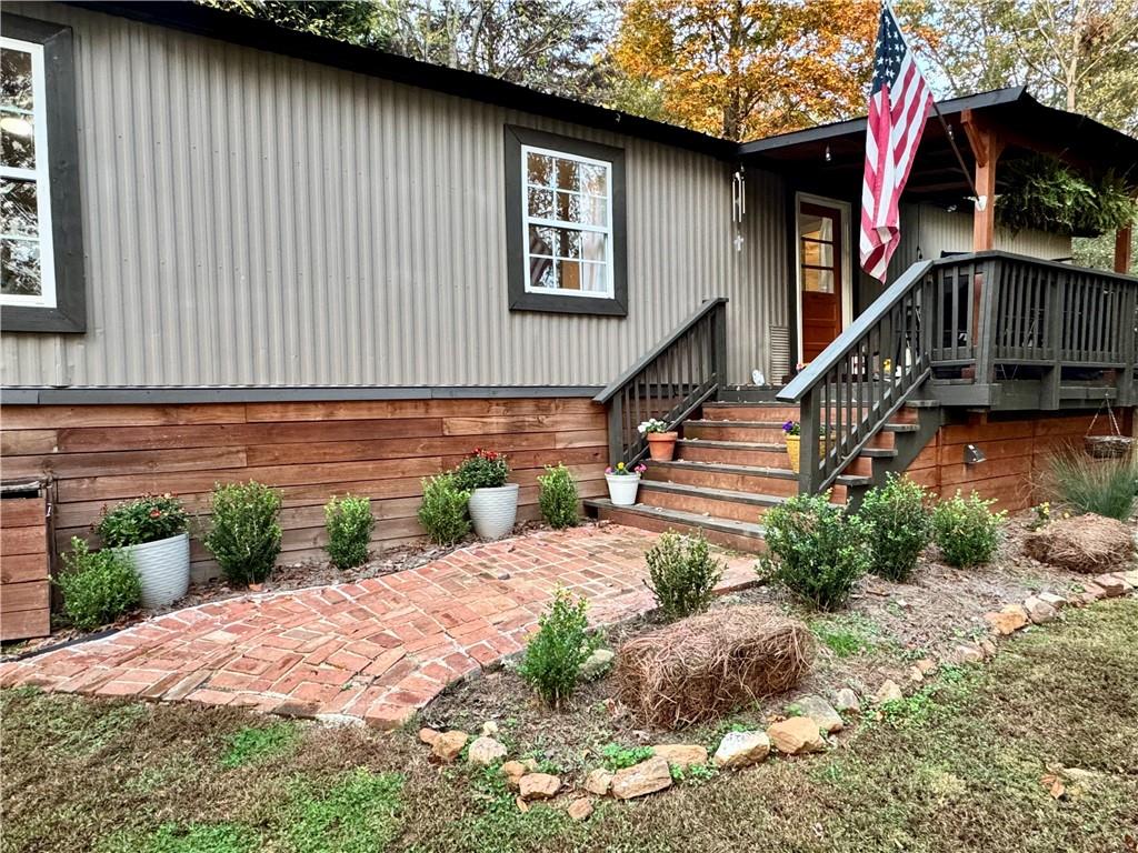 a pathway of a house with a yard