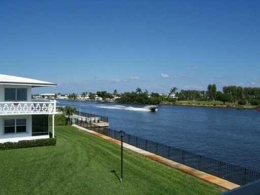 a view of house with outdoor space and lake view