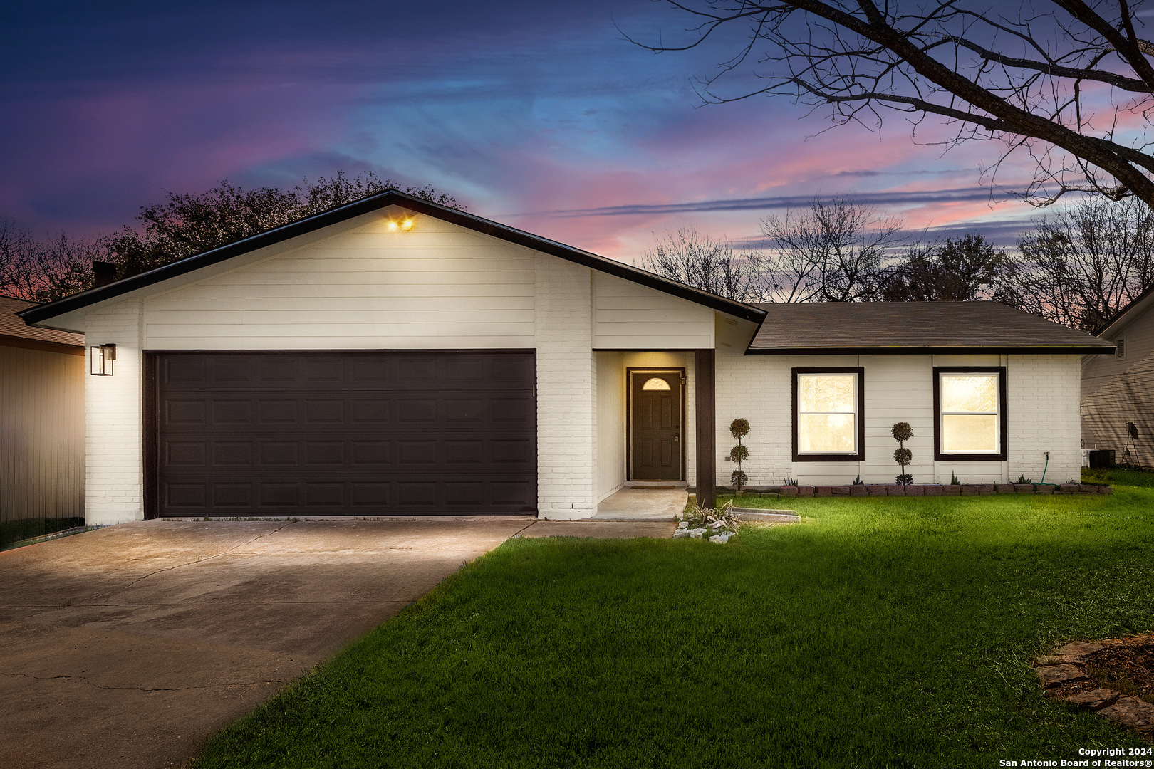 a front view of a house with a yard