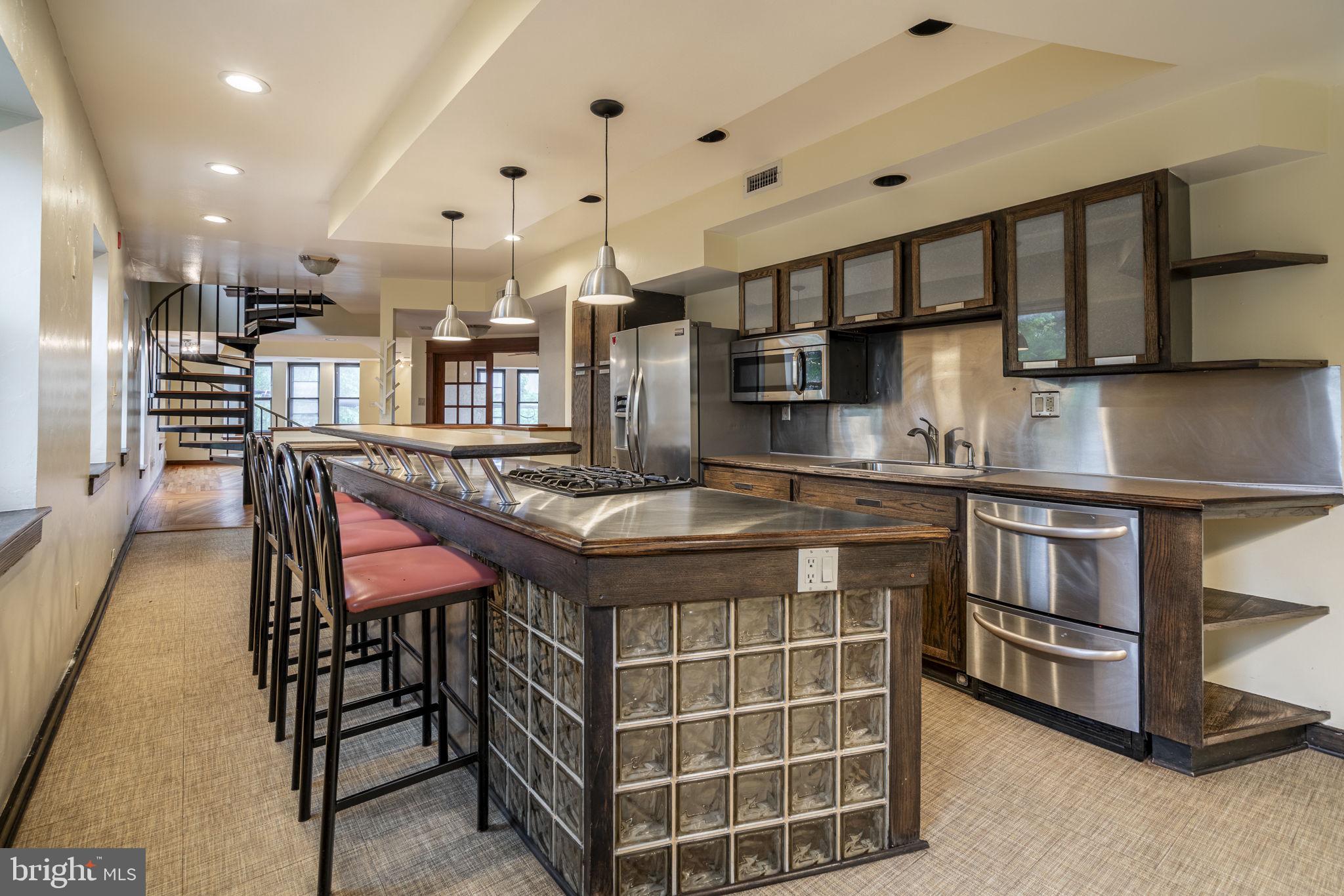 a kitchen with a sink counter top space and appliances