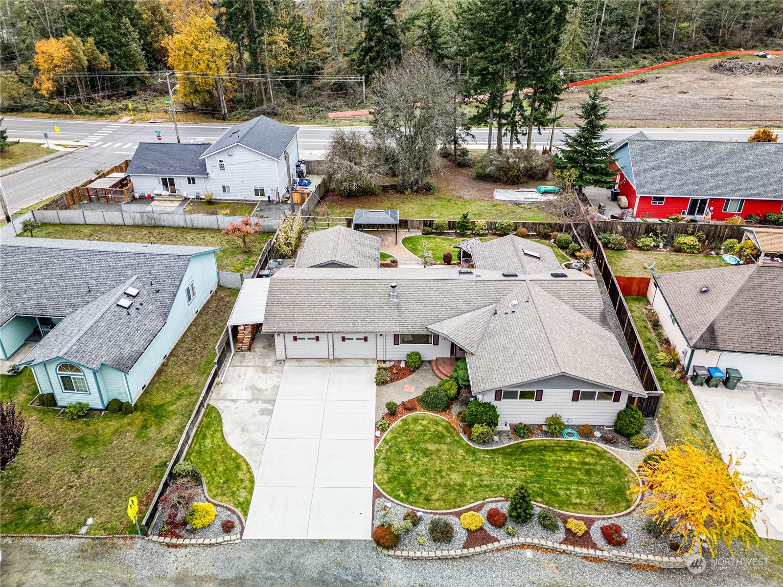 an aerial view of residential houses with outdoor space and swimming pool