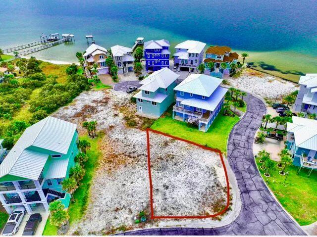 an aerial view of a house with a yard basket ball court