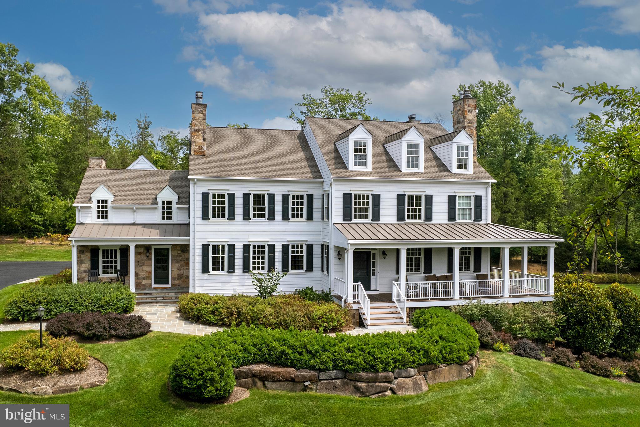 a front view of a residential apartment building with a yard