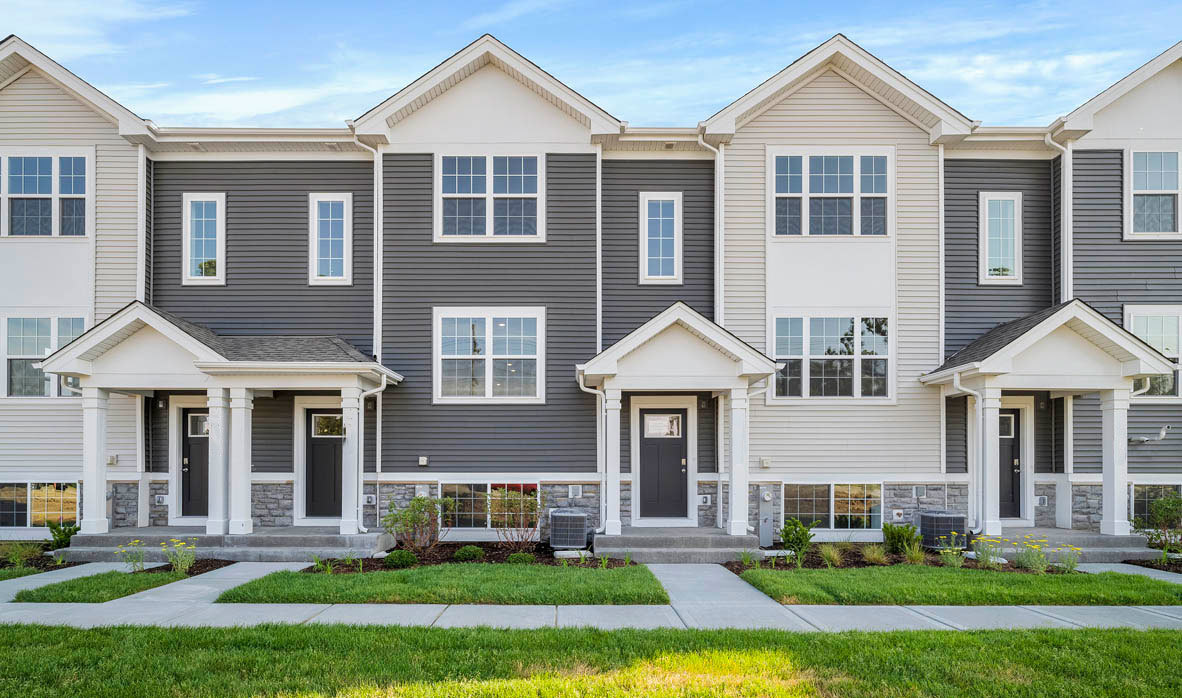 a front view of a house with a yard