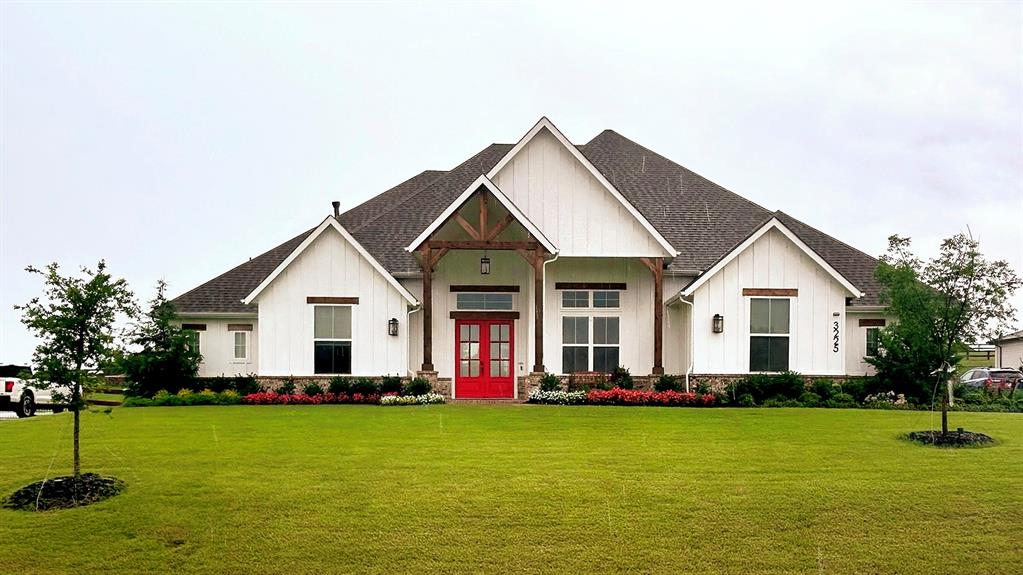 a front view of house with yard and green space