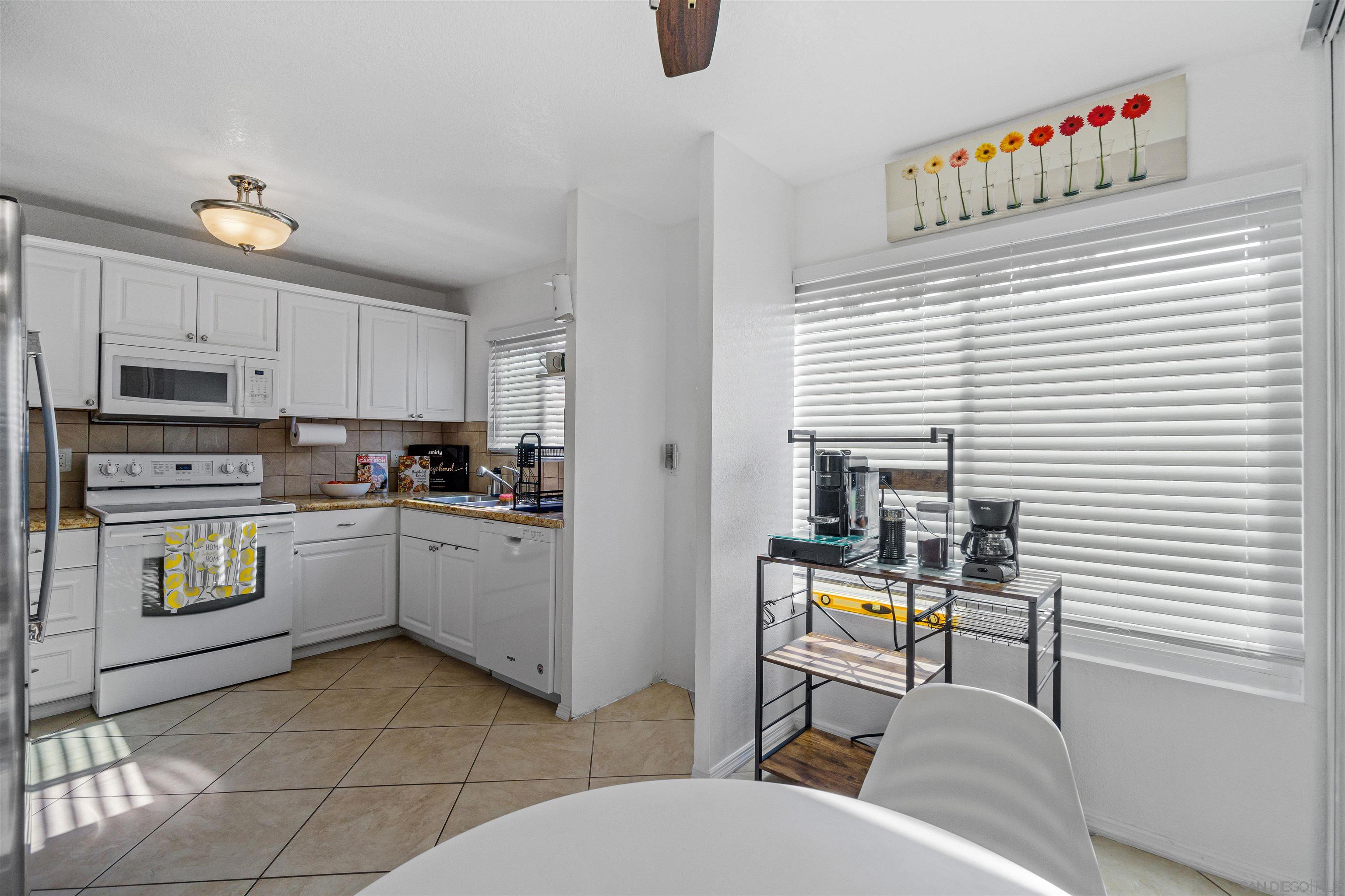 a kitchen with a sink and appliances