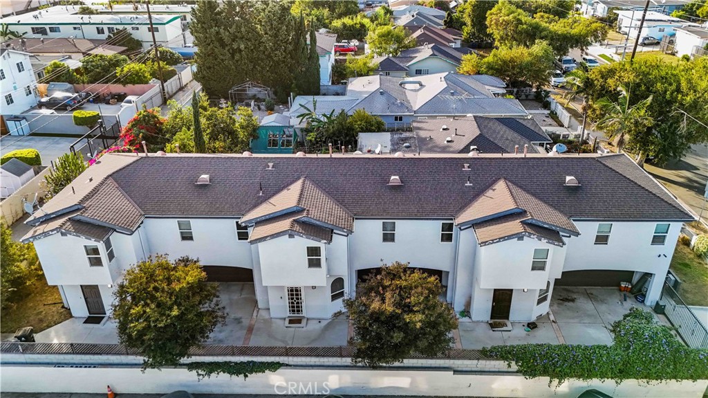 an aerial view of house with yard