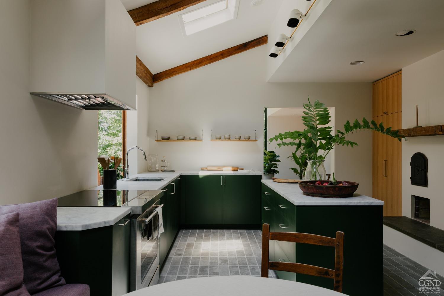 a kitchen with a table and chairs in it