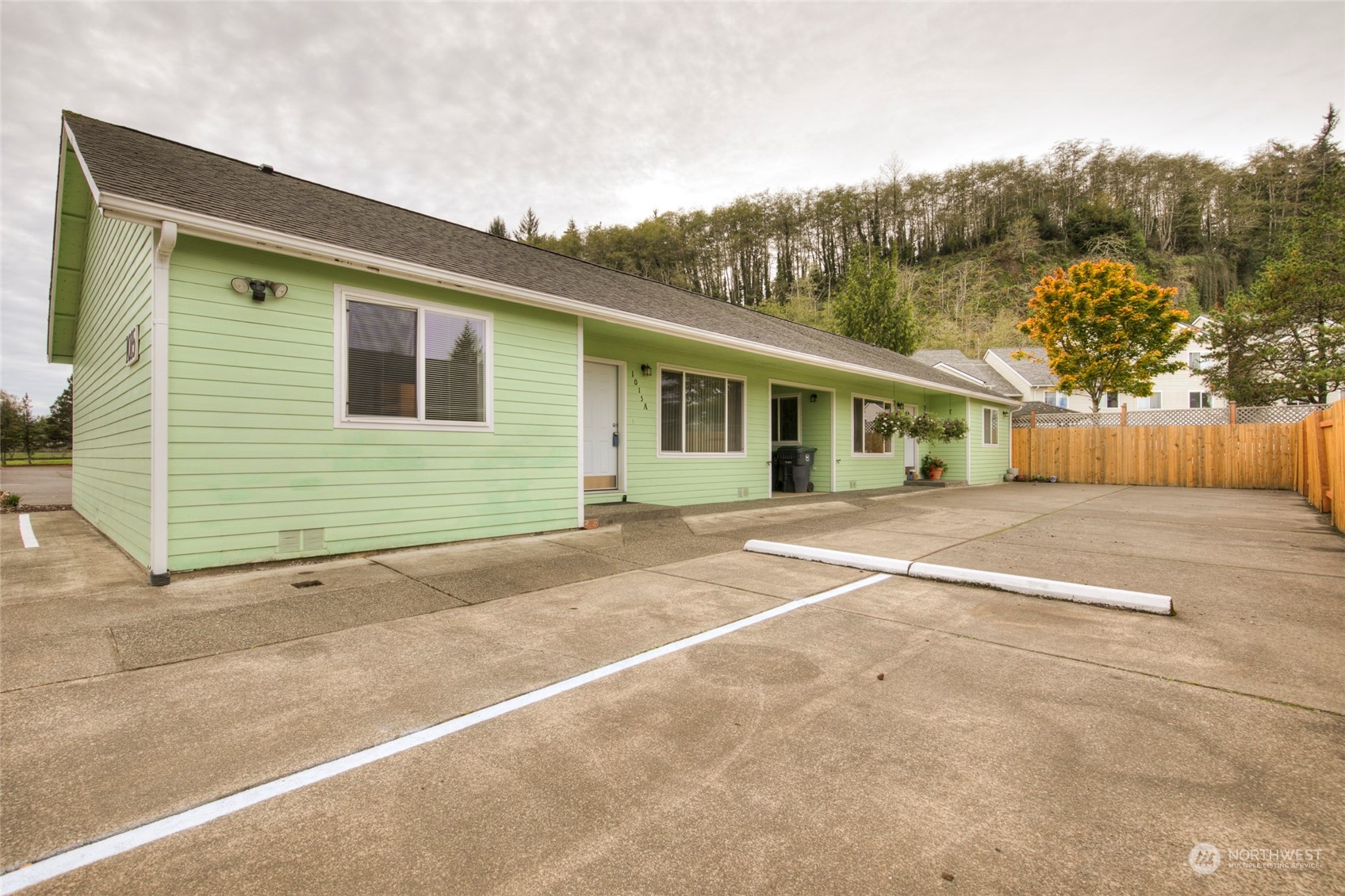 a view of a house with a backyard and a garage