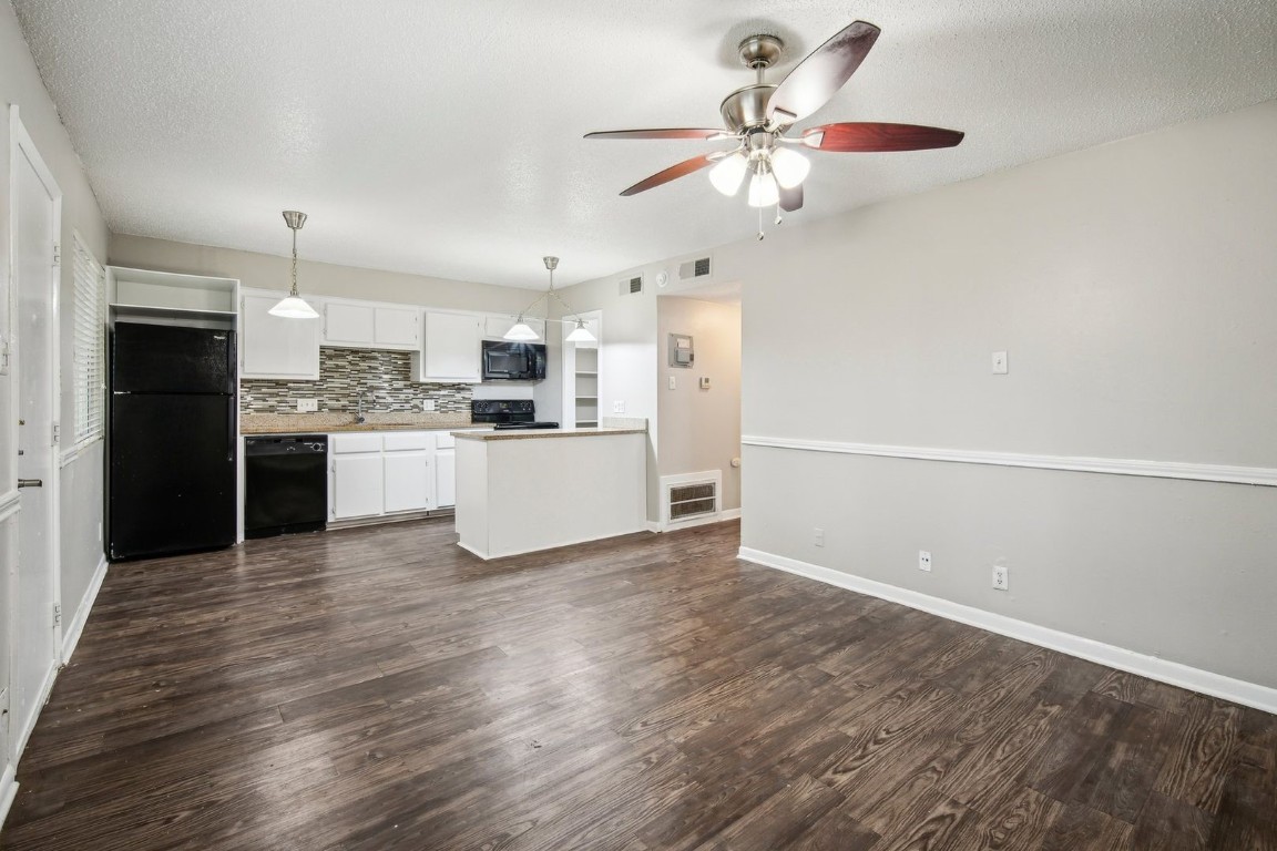 a view of kitchen with wooden floor