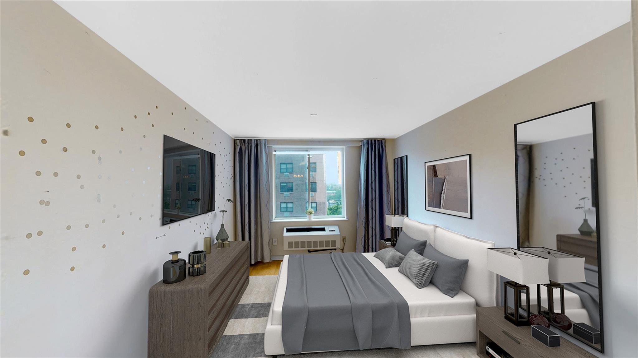 Bedroom featuring a wall mounted air conditioner and light hardwood / wood-style flooring