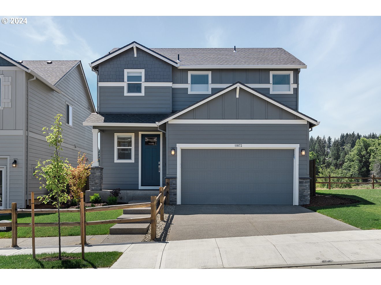 a front view of a house with a yard