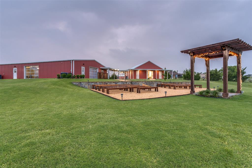 a front view of a house with a big yard