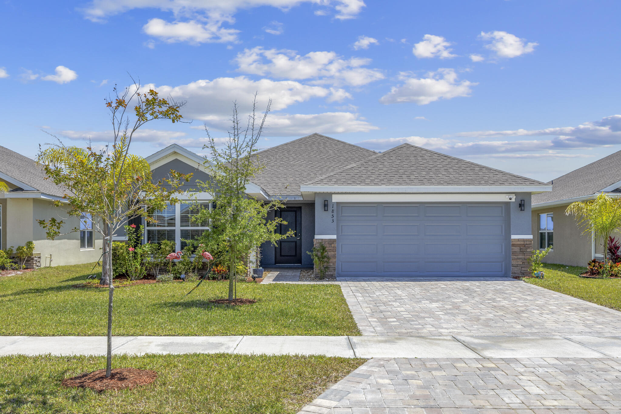 a front view of a house with garden